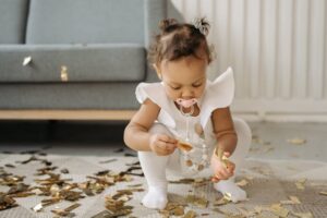 toddler with soother in her mouth
